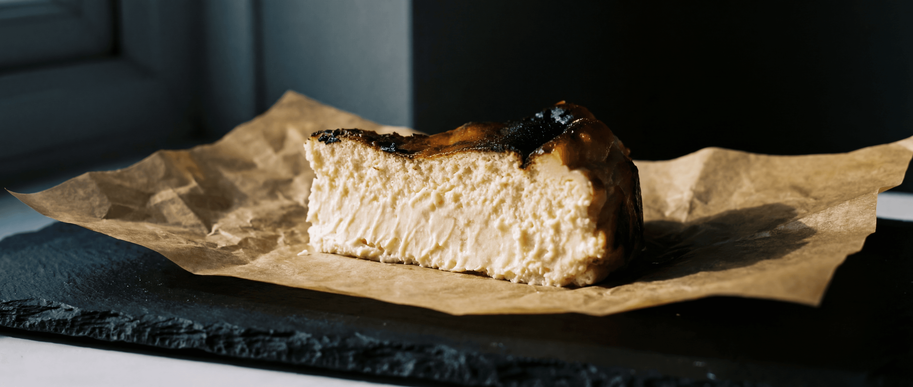Basque cheesecake, dark caramelised crust with pale creamy interior